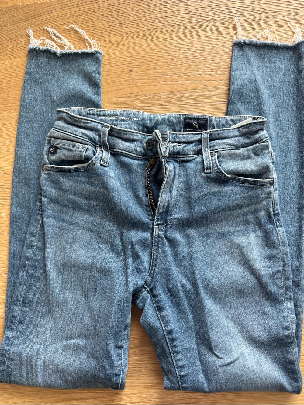 AG frayed hem jeans.